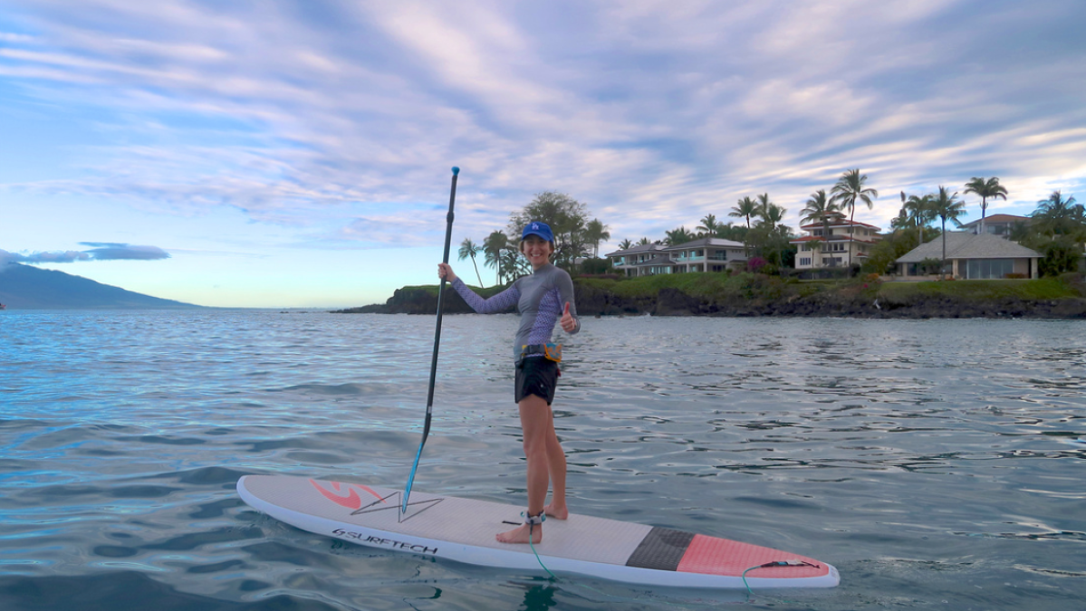 Woman smiling on paddleboard